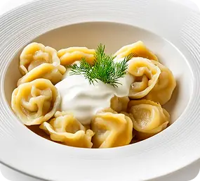 Пельмени со сметаной (180/30 г)